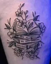 Stack of books with flowers and a quote banner