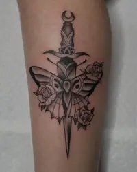 Traditional dagger through a moth with roses in black and grey