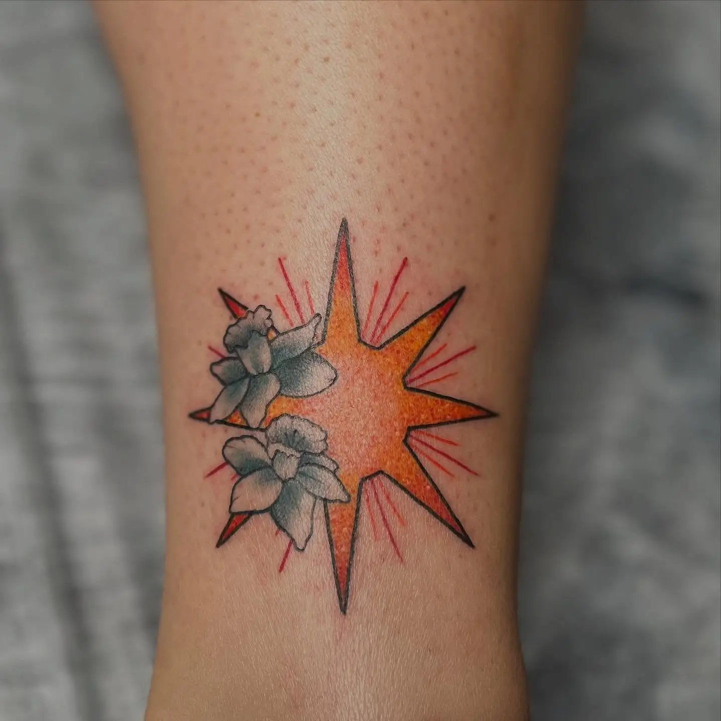 Orange sun with sparkle shading and daffodils