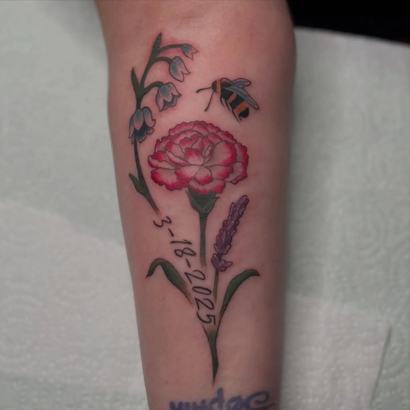 Red carnation with lavender and a small bee