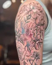 Magnolia flowers with soft color on an upper arm
