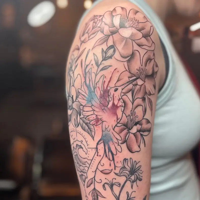 Magnolia flowers with soft color on an upper arm