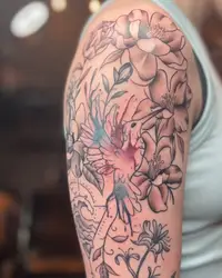 Magnolia flowers with soft color on an upper arm