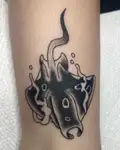 Black manta ray used to cover an older tattoo