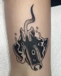Black manta ray used to cover an older tattoo