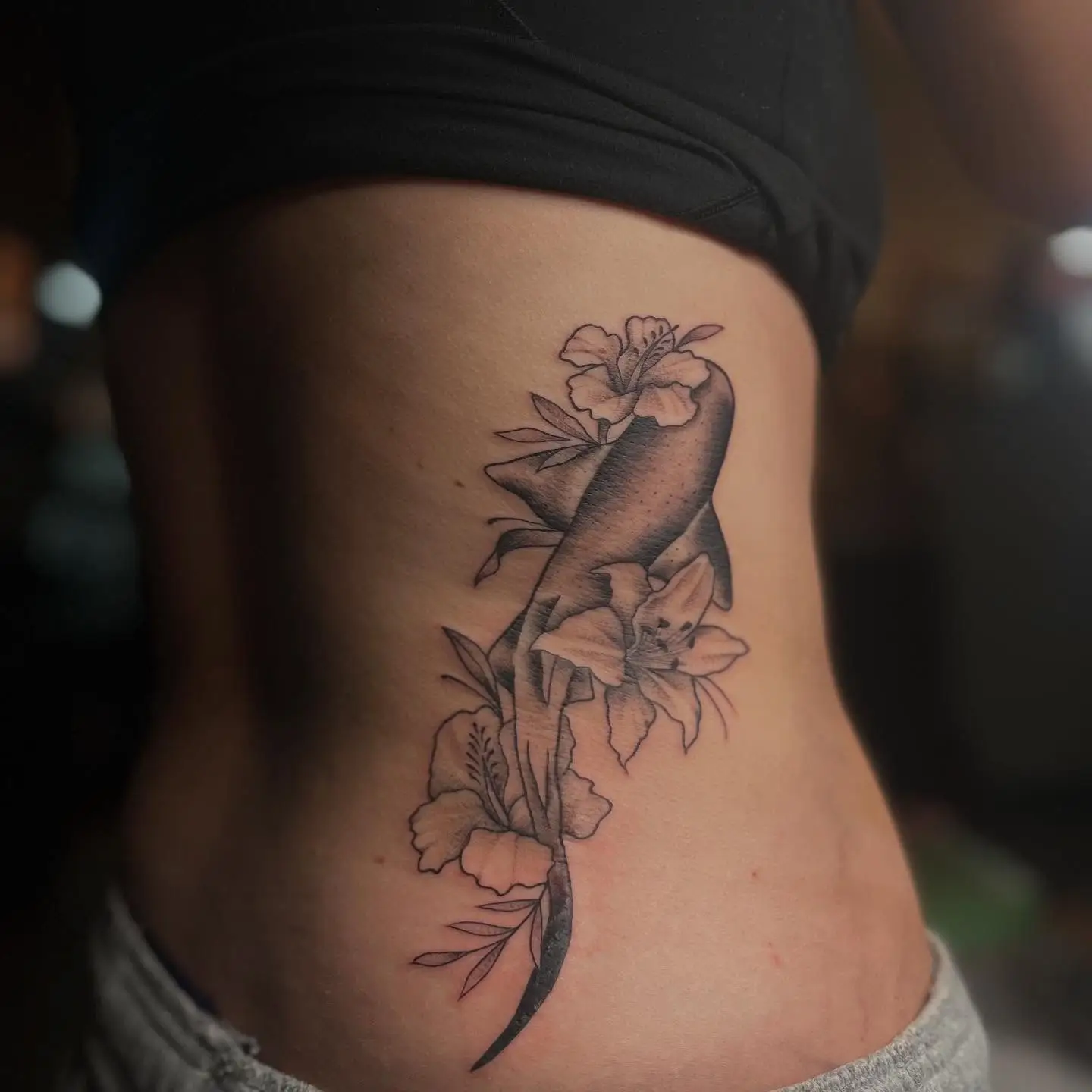Nurse shark with hibiscus and lily on the ribs