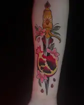 Dagger through a pomegranate with a spider in red and black