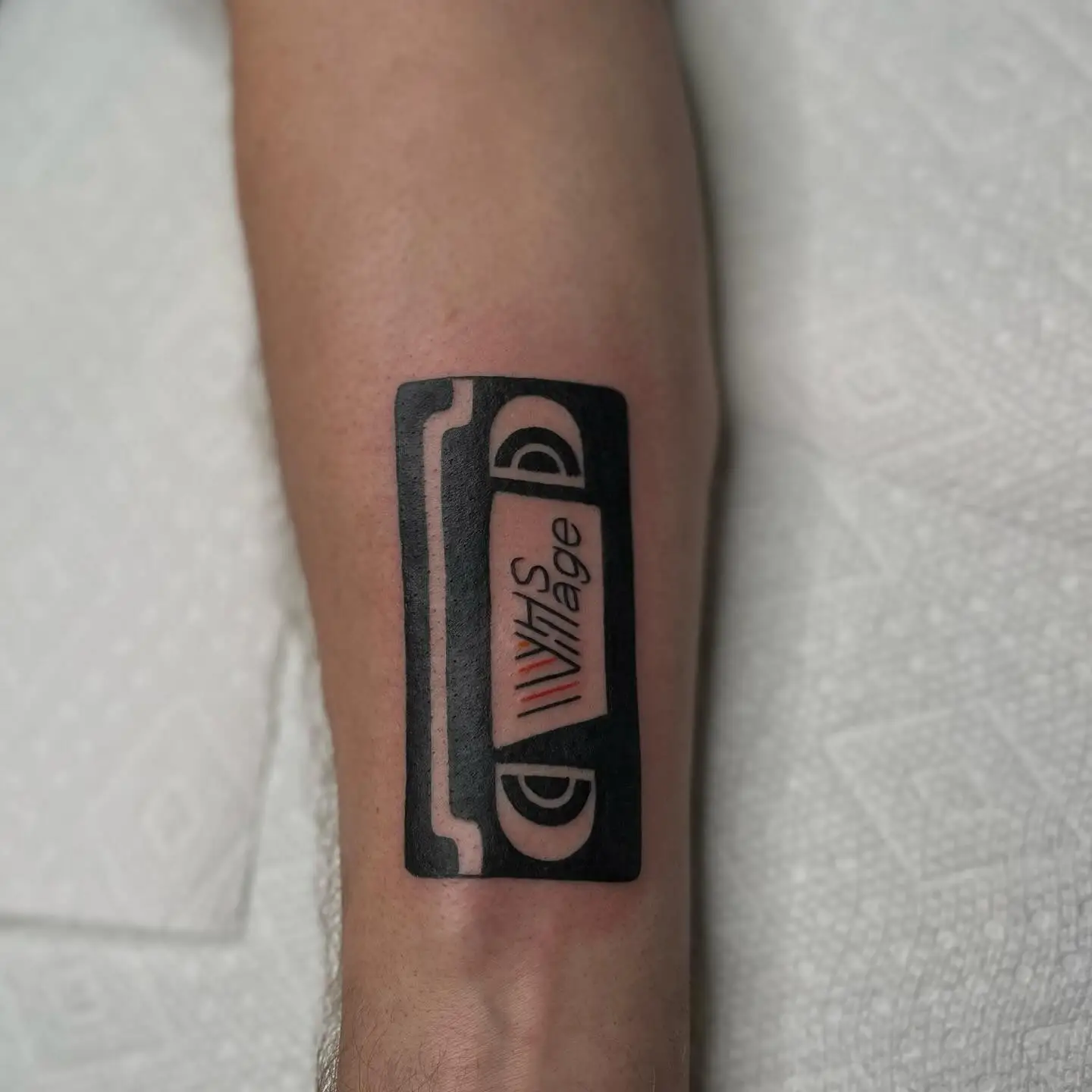 Bold VHS tape in black with a color label
